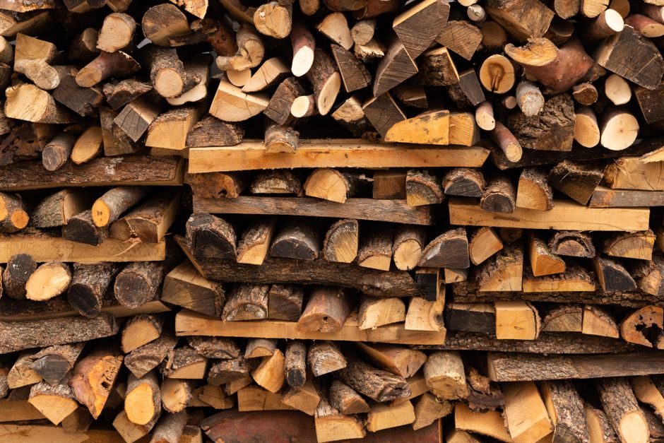 A person gripping an axe to split firewood in autumn, a common cause of inner elbow strain